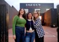 Comedy producers pose in front of the Hollywood Improv Club