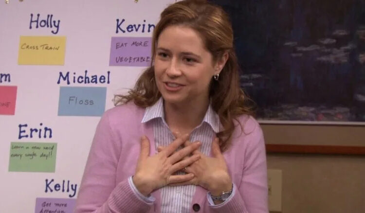 Pam Beesly stands in front of a resolution board in The Office (2011)