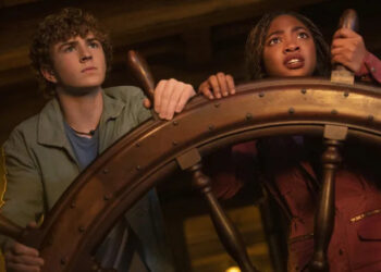 Percy and Annabeth holding a ship wheel in "Percy Jackson and the Olympians"