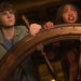 Percy and Annabeth holding a ship wheel in "Percy Jackson and the Olympians"