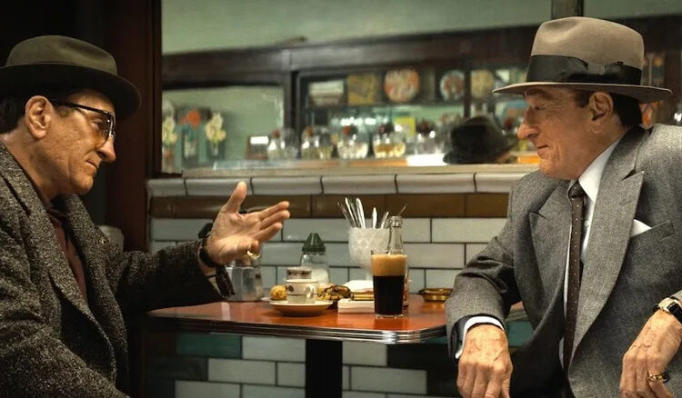 Robert De Niro sits in a diner playing both Frank Costello and Vito Genovese in The Alto Knights