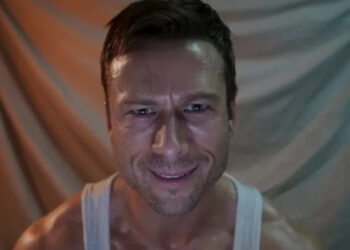 Glen Powell as Ben Richards recording a video diary in The Running Man