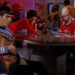 Spock holding a musical instrument as his crewmates play card in "Star Trek"