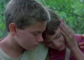 River Phoenix's Chris comforting Will Wheaton's Gordie in Stand By Me
