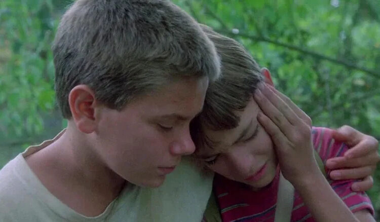 River Phoenix's Chris comforting Will Wheaton's Gordie in Stand By Me