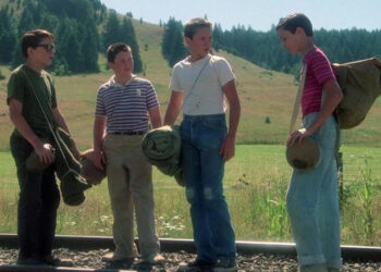 Teddy Duchamp, Vern Tessio, Chris Chambers, and Gordie Lachance stand on train tracks in Stand by Me (1986)