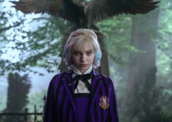 Wednesday (as Enid) stands near a grave in Jericho in Wednesday