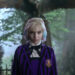Wednesday (as Enid) stands near a grave in Jericho in Wednesday