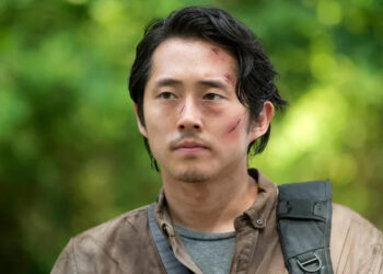 Glenn walking in the woods in The Walking Dead