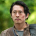 Glenn walking in the woods in The Walking Dead