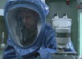 Dr. Jenner wearing biohazard suit in a lab in "The Walking Dead" (2010-2022)