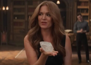 Isla Fisher as Henley in Now You See Me: Now You Don't. She's holding up a diamond with her left hand. .