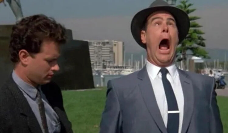 Dan Aykroyd as Sgt. Joe Friday yelps and crosses his eyes in Dragnet
