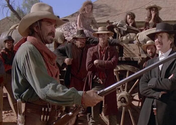 Quigley holding his rifle in Quigley Down Under