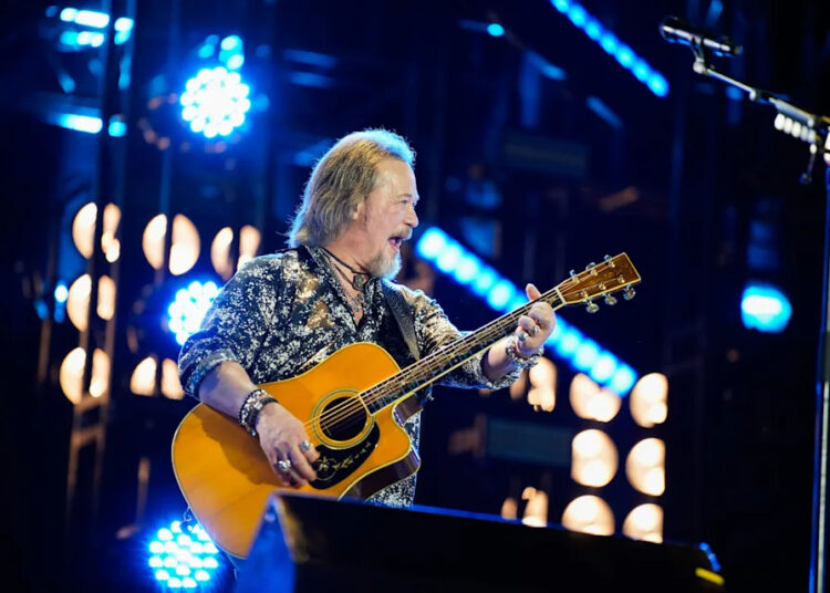 Travis Tritt performs with Jason Aldean at the CMA Fest at Nissan Stadium in Nashville, Tenn., Friday, June 6, 2025.