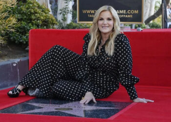 Country music singer Trisha Yearwood sits next to her star during an unveiling ceremony honoring her with the 2,805th star on the Hollywood Walk of Fame in Los Angeles in March. File Photo by Jim Ruymen/UPI