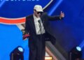 Bad Bunny accepting the award for best urban song for "DtMF," during the 2025 Latin Grammys.