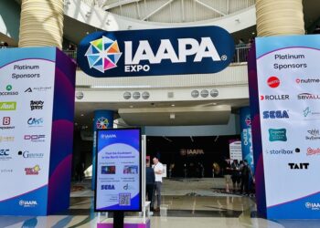 Entrance to IAAPA Expo with sponsor logos displayed on large pillars.