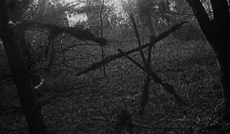 Iconic creepy stick figures in The Blair Witch Project
