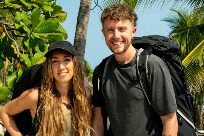 Harleymoon and Roman Kemp stood next to each other smiling ahead.