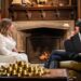 Charlotte Church and Claudia Winkleman sit opposite on arm chairs deep in conversation.