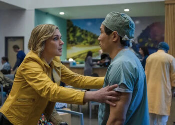 Pluribus Carol grabbing Dr. Nguyen's arms in hospital cafe