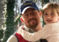 Channing Tatum as Jimmy carrying Farrah Mackenzie as Sadie in Logan Lucky