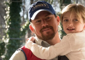 Channing Tatum as Jimmy carrying Farrah Mackenzie as Sadie in Logan Lucky
