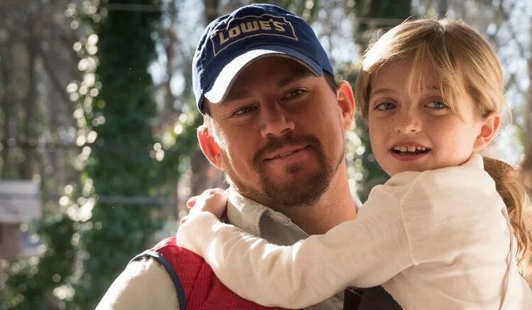 Channing Tatum as Jimmy carrying Farrah Mackenzie as Sadie in Logan Lucky