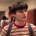 Noah Schnapp's Will Byers stands in a school hallway in Stranger Things
