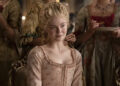 Catherine sitting amongst her ladies smirking in The Great