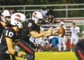 Cannon Crompton/sports@cherokeescout.com Andrews quarterback Brady McLelland gets the ball against Anderson on Sept. 12.