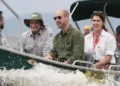 PA Media Five people on a boat, with William in the centre, wearing dark sunglasses. On his right are two men, on his left is a woman and a another man. In the forefront of the picture is sea spray as the boat moves through the water