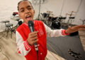 In this file photo, Angelo Gray, 10, sings the crescendo of the national anthem at Unity Radio Station.