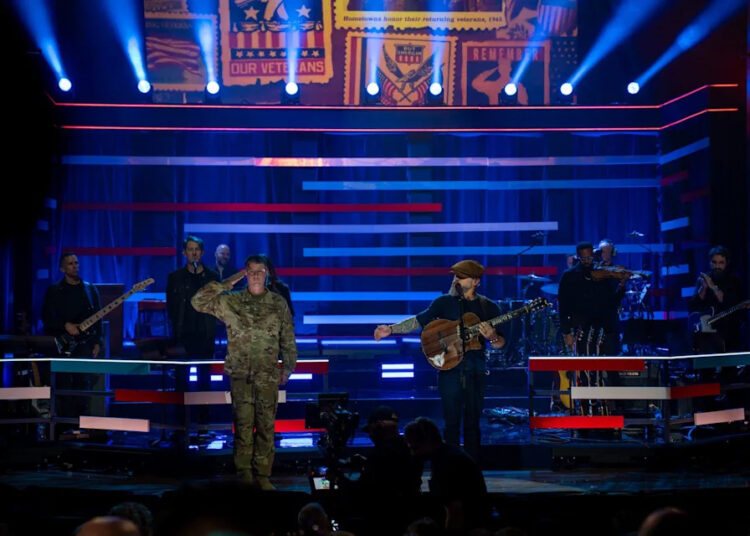 Zac Brown performs his song "Chicken Fried" alongside a soldier onstage during the Nov. 7 Proud to Honor event  in Nashville.