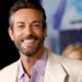 Zachary Levi poses for photos at a press event.
