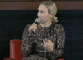 Zara Tindall wearing a leopard dress speaking on stage