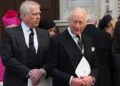 Prince Andrew and King Charles stand side by side.