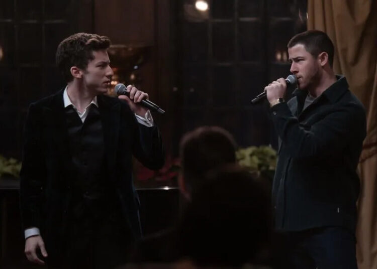 Andrew Barth Feldman and Nick Jonas in 'A Very Jonas Christmas Movie,' Disney+, premiered November 14. 2025.