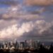 Storm clouds pass over the Downtown Los Angeles skyline