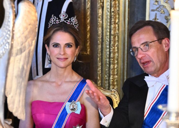 Princess Madeleine of Sweden and Prime Minister Ulf Kristersson attend a state banquet in honor of the visiting President of Iceland at the Royal Palace in Stockholm on May 6, 2025 (Claudio Bresciani/TT News Agency/Alamy)