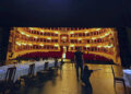A flash mob waves Ukrainian flags as La Scala features a Russian opera for its gala season premiere