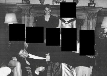 A picture of Andrew Mountbatten-Windsor lying across a row of women in a photo during a black-tie event with Ghislaine Maxwell has been released as part of the Epstein files