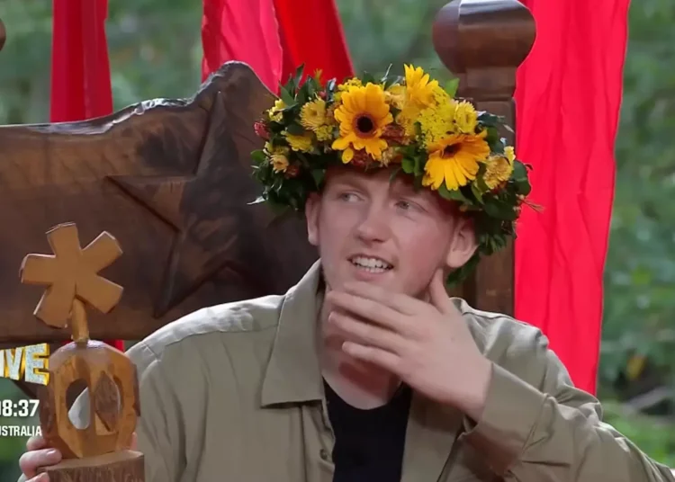 Angry Ginge sits down for his post-win interview, still emotional and smiling, as studio lights and the jungle backdrop frame the moment he reflects on becoming King of the Jungle 2025.