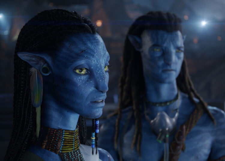 (L-R) Neytiri (Zoe Saldaña) and Jake Sully (Sam Worthington).