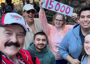 In this photo provided by Jon Alan Hale, Hale, left, poses with friends after taking his 15,000th Radiator Springs Racers ride at Disney California Adventure in Anaheim, Calif., on Monday. (Jon Alan Hale via AP)