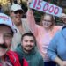 In this photo provided by Jon Alan Hale, Hale, left, poses with friends after taking his 15,000th Radiator Springs Racers ride at Disney California Adventure in Anaheim, Calif., on Monday. (Jon Alan Hale via AP)