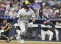 Milwaukee Brewers' Isaac Collins (6) runs after hitting a RBI single to score Jackson Chourio during the fourth inning of a baseball game against the Miami Marlins, Saturday, July 5, 2025, in Miami.
