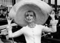 French actress Brigitte Bardot poses with a huge sombrero she brought back from Mexico, as she arrives at Orly Airport in Paris, France, on May 27, 1965. (AP Photo/File)