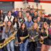 Students in jazz band pose with their instruments.